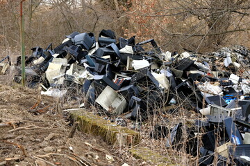 Old computers and monitors in a landfill - obrazy, fototapety, plakaty