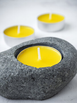 Citronella anti-mosquito candles on white rustic background