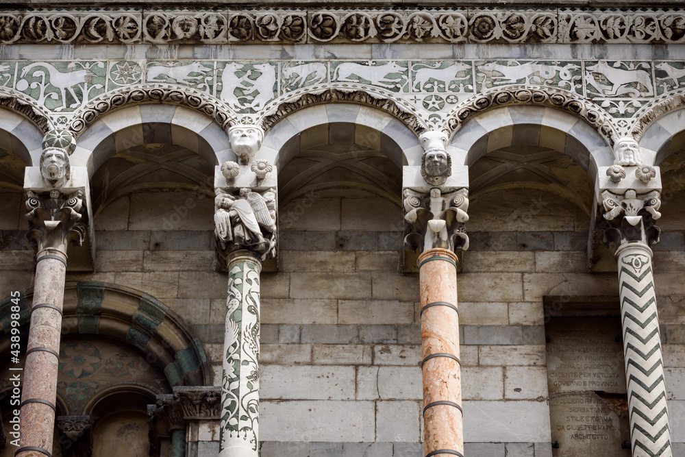 Wall mural lucca (tuscany, italy), church of san michele. details of the columns and arches of the medieval fac