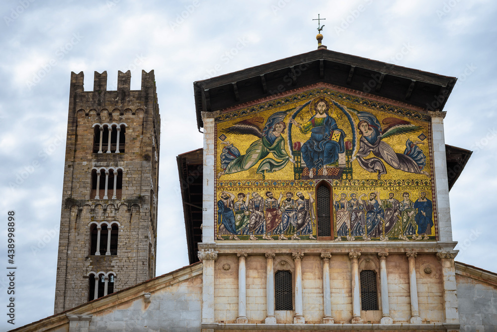 Wall mural detail of the medieval mosaic on the facade of the ancient church of san frediano, romanesque buildi