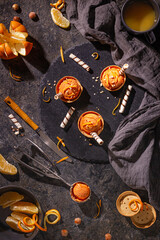 Homemade orange ice cream on a dark background with Ice cream spoon from stainless steel, flat lay, top view