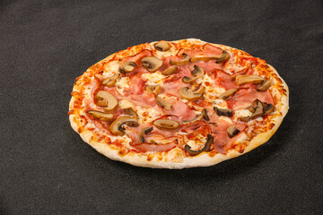 Pizza with ham, cheese and mushrooms