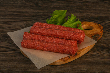 Raw beef sausages with spices