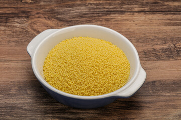 Raw cous cous heap in the bowl