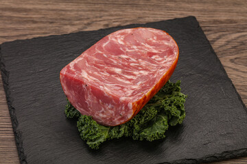 Beef ham piece over board