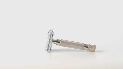 Metallic safety razor isolated on white background, close view 