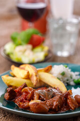 greek stifado meat stew with fries