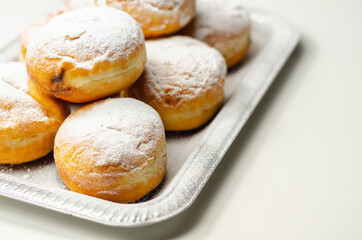 Berliner Pfannkuchen, a German donut, traditional yeast dough deep fried filled with chocolate...