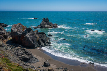 Incredible landscape of the coast. Beautiful blue sea. The waves rolled ashore and breaking on the rocks. Kortum trail, California, USA