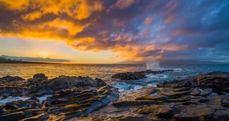 Amazing sunset with yellow sky over the sea. Beautiful nature of Hawaii. Makaluapuna point, Maui, Hawaii, USA