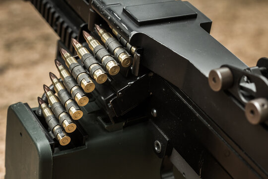 M249 light machine gun with 7.62 mm cartridge belt black and white