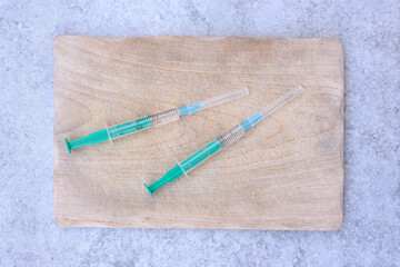 Syringes on kitchen cutting board