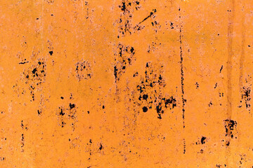 Metal rusty wall with yellow peeling paint