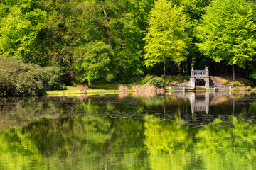 Lake with artificial waterfall in royal park Kroondomein