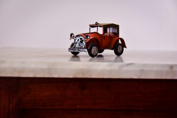 miniature old car with hood
