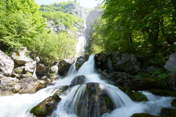 Fototapeta na wymiar beautiful waterfall in the hiking destination theth in the albanian alps