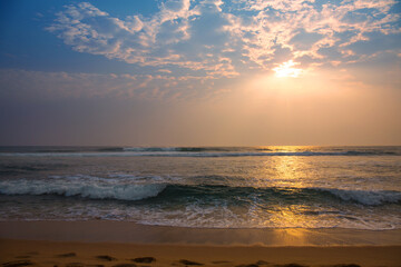 Naklejka na ściany i meble Sunset on the ocean, golden time