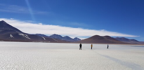 Boys walk on a frozen lake