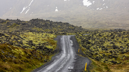 Scenic back road through lava fields in Snaefellsnes national park in Iceland