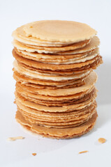 Sembei, a traditional japanese crackers on white table or background and a few crumbs.