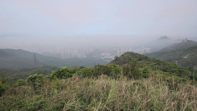 4K Timelapse high angle view of Beautiful misty morning landscape at Kowloon Peak, Hong Kong