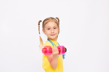 Portrait of happy little girl with dumbbells isolated on white background