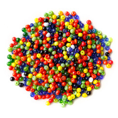 lots of small, multi-colored glass beads, isolated on a white background