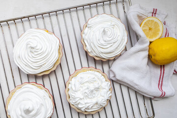 Lemon Merinque Tartlets before baking on a grid backing tray