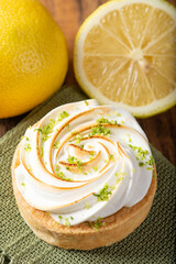 LEMON PIE WITH LEMONS AROUND IT