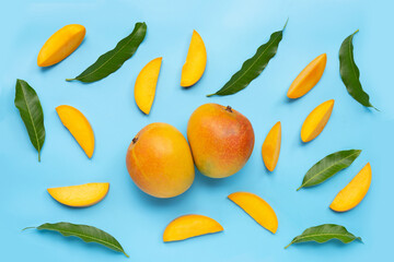 Tropical fruit, Mango on blue background.