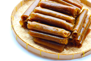 Dried mango paste on white background.