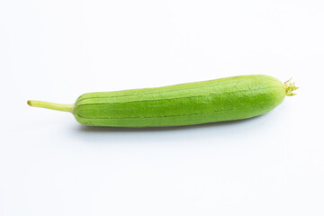 Fresh angled gourd on white