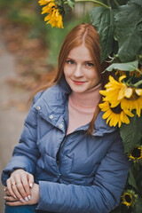 A girl on the background of sunflowers in autumn 2754.