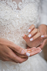 Hugs of newlyweds with wedding rings 2783.
