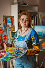 An experienced artist works in her own studio 2901.