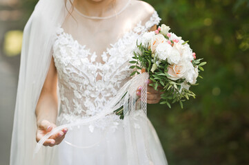 A floating bouquet in the hands of the bride in nature 3198.