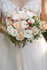 A bouquet of beautiful flowers in the hands of the bride 3200.