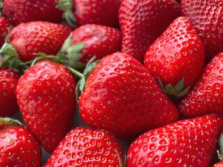 Flatlay from a large number of strawberries. Natural background.