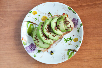 vegetarian sandwich with avocado with flax seeds breakfast bread