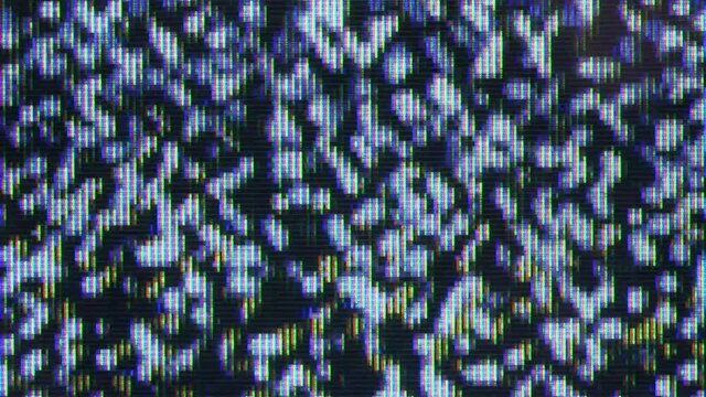 Close up view at a plasma tv while showing white noise .