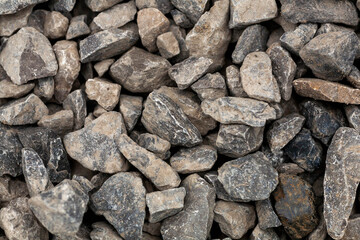 brick rubble debris on construction site. inorganic crushed stone, non-round, loose material with grains. Artificially obtained by crushing coarse-grained rocks and pebbles, accidentally mined