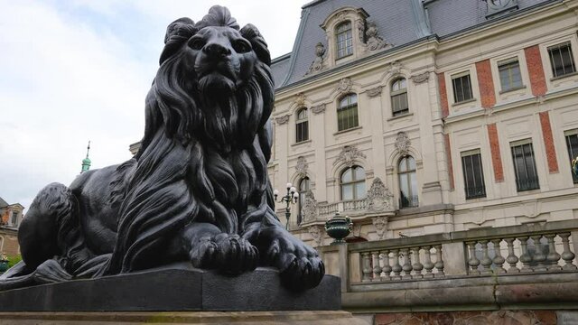Lion sculpture in front of Castle in Pszczyna town in Silesia region of Poland, 4k video