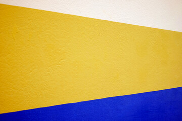 Three colors, white yellow and blue, horizontal frame angled perspective.