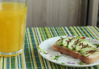 sandwich with green avocado flax seeds and juice healthy breakfast