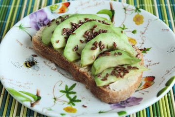 sandwich with green avocado and flax seeds vegetables 