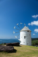 Fototapeta na wymiar windmill on the beach