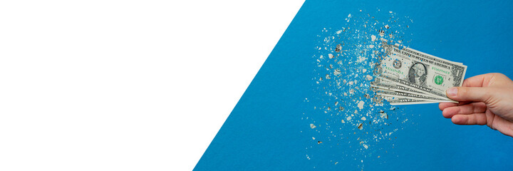 Inflation, dollar hyper inflation. Banner with blue background. One dollar bill is sprayed in the...