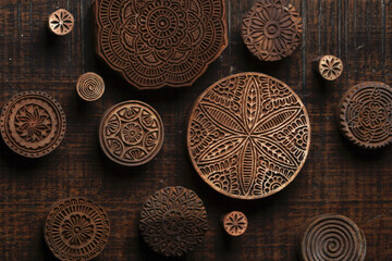 Round shape traditional Indian wood block pattern for textile printing on rustic wood background....