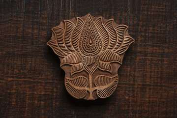 Lotus shape Indian wood block pattern for textile printing on rustic wood background. Block Printing,Rajasthan India Block Printing, Wood block used for handmade textile printing,Hand craft