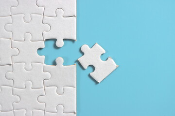 Jigsaw puzzle with missing piece. Missing puzzle pieces. Concept image of unfinished task. Completing final task, missing jigsaw puzzle pieces and business concept with a puzzle piece missing. blue